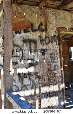 Grungy graffiti in an abandoned building. Old wall.