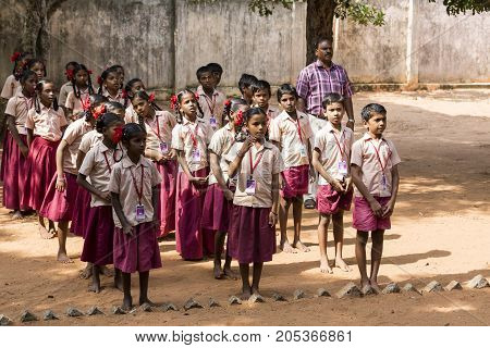 PONDICHERY PUDUCHERY INDIA - SSEPTEMBER 04 2017. School parade of each monday morning with children students in uniforms. They walk sing and pray before going in the classrooms.