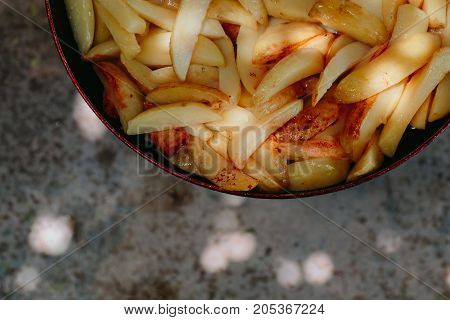 Fried potatoes in a frying pan Outdoors
