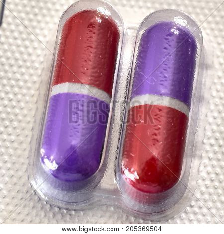 Pills for medical treatment. Pharmaceutical type images showing a verity of pills / capsules.
