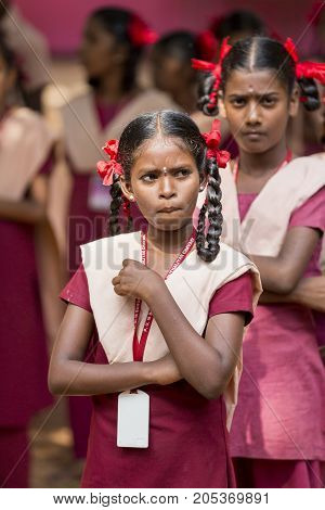 PONDICHERY PUDUCHERY INDIA - SSEPTEMBER 04 2017. School parade of each monday morning with children students in uniforms. They walk sing and pray before going in the classrooms.