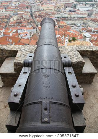 View from atop a historic cannon in Lisbon - Lisboa. Jardim Júlio de Castilho. Castle of St George Lisbon is the captial city of Portugal