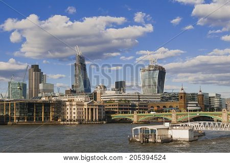 LONDON UK - AUGUST 11 2013; The new London's giants office tower under construction photographed from the Thames River