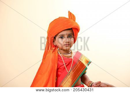 cute indian child in traditional style , posing