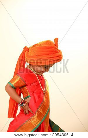 cute indian child in traditional style , posing