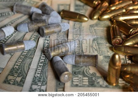Bullet on american dollars gunpowder with gunpowder. Background money and bullets