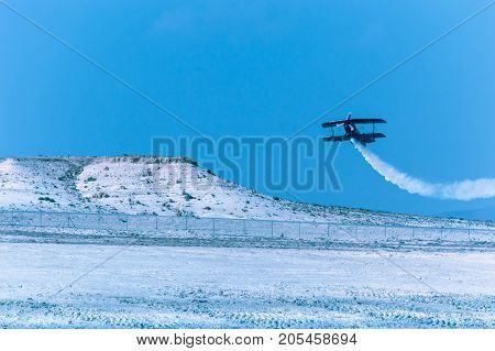 Sivrihisar Eskisehir Turkey - September 17 2017: Sivrihisar Airshows (SHG) small aviation event displayed in SUSHM. Ali Ismet Ozturk flying with his aerobatic plane 