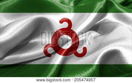Realistic flag of Ingushetia on the wavy surface of fabric. This flag can be used in design
