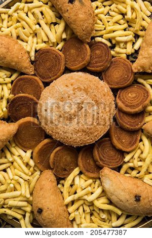 stock photo of Indian festival or diwali food called Bakarvadi , aloo sev bhujiya and karanji or Gujiya, selective focus