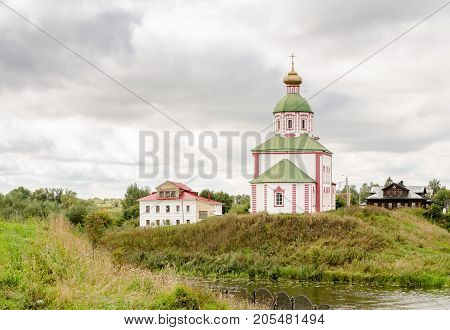 View of the Church of Elijah the Prophet on Ivanova mountain or Elias Church before the storm in Suzdal, Russia. Golden Ring of Russia.