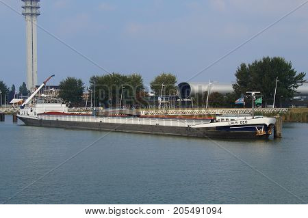 Lelystad, The Netherlands - September 24, 2017: Inland waterway motor freighter Laus Deo lying in the harbor of Lelystad.