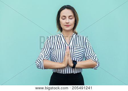 Meditation, Religion And Spiritual Practises. Beautiful Business Woman Doing Yoga Indoors At Light B