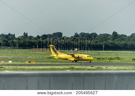 Dusseldorf, Germany - 03.09.2017: ADAC air ambulance taxi plane towards the runway to depart Dusseldorf International Airport
