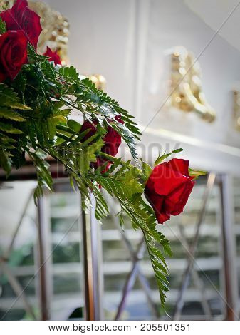 closeup shot of a colorful casket in a hearse or chapel before funeral or burial at cemetery