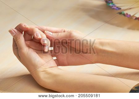 Beautiful woman hands in nail salon. Female hands in beauty salon ready for manicure. Caucasian woman clean and gentle hands on salon table.