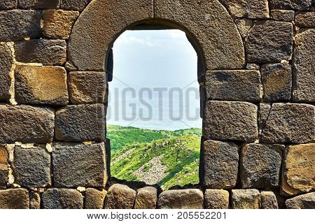 View through the window in brick wall of the medieval armenian fortress Amberd