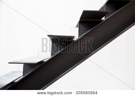 Installation of steel stairs using steel i-beams.