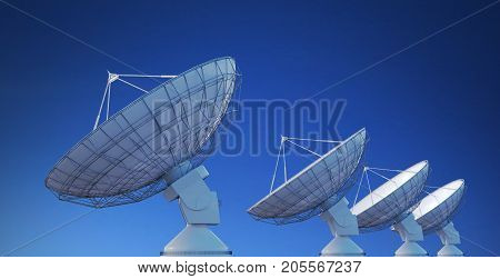 Array Of Satellite Dishes Or Radio Antennas Against Blue Sky. 3D