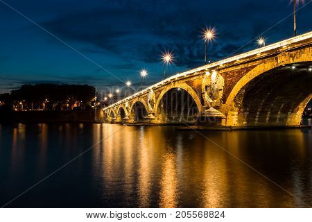 Illuminated bridge in the evening, Toulouse, France