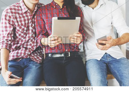 Peole using tablet and smartphone. Technology concept