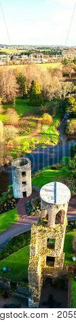Blarney, Ireland. Autumn in Ireland. Aerial view of Blarney Castle tower in Ireland. Forest and fields at the background