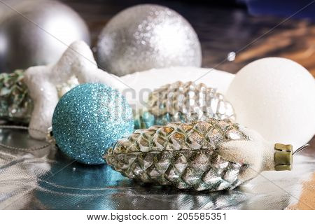 New year silver decoration on briliance background. Top view