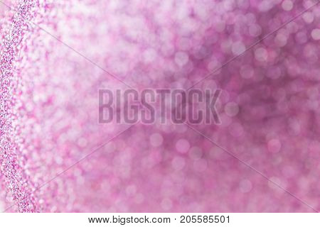 Purple Festive Christmas background. Abstract twinkled bright background with bokeh defocused lights