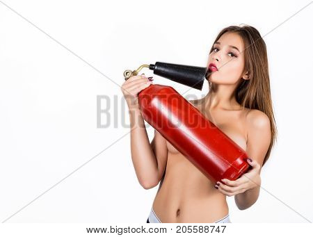 Sexy sensual female firefighter with a red fire extinguisher, with free space for your text.