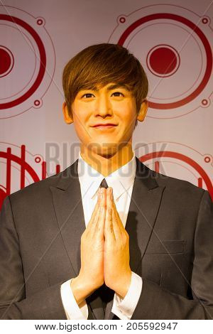 BANGKOK THAILAND - DECEMBER 19: A waxwork of Nichkhun Horvejkul on display at Madame Tussauds on December 19 2015 in Bangkok Thailand.