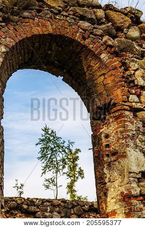 very old Kazdangas church wall of stones.