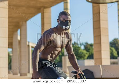 Male Muscular Training With Battle Ropes And Training Mask