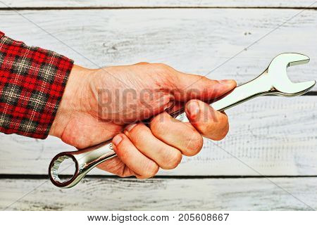 Male Person Holding Spanner In Hand