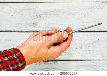 Male Hand With A Screwdriver, Handyman Concept