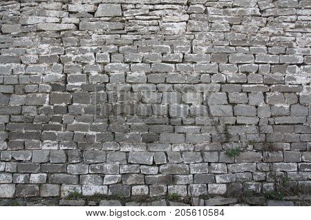 Ancient wall of the monastery from the rough stone in the heart of Russia