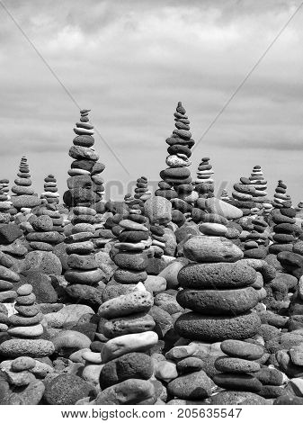 rock art tall piles and towers of grey grey stones and pebbles