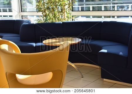 sofas and armchairs of a waiting room for travelers