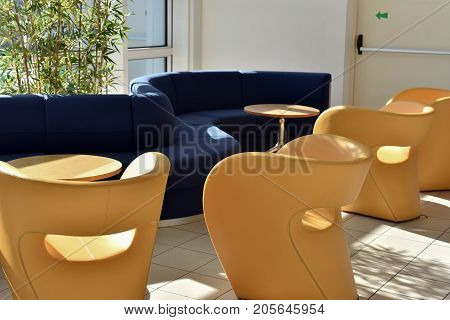 sofas and armchairs of a waiting room for travelers