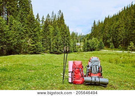 Backpacks in the mountains with views of the mountains.