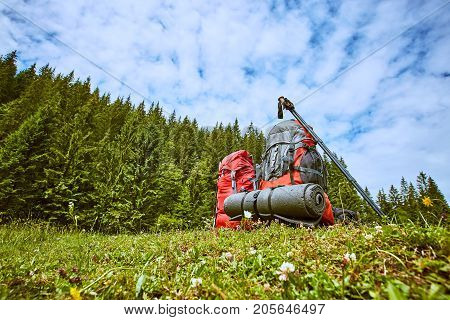 Backpacks in the mountains with views of the mountains.