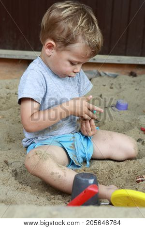 Boy In Sandbox