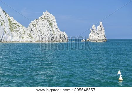 Numana - Due Sorelle bay - White coast with blue sky and sea. for summer vacation concept