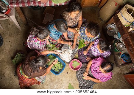 January 20, 2015 San Pedro La Laguna, Guatemala: Mayan Women In Traditional Wear Preparing Food Toge