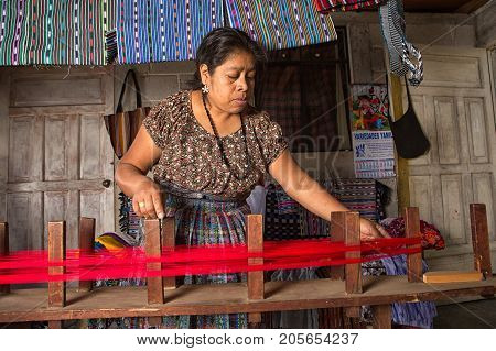 January 20, 2015 San Pedro La Laguna, Guatemala: Mayan Woman Preparing Yarn Forn Traditional Belt