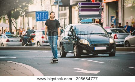 Professional Skater Riding Skate On Streets Through Cars And Traffic