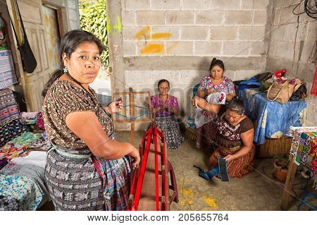 January 20, 2015 San Pedro La Laguna, Guatemala: Artisan Mayan Tzutujil Women Working Indoors