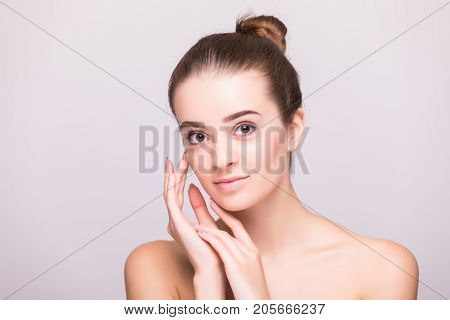 Beautiful Woman Face Close Up Hand Touching Face Studio On Gray