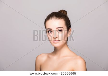 Beautiful Woman Face Close Up Hand Touching Face Studio On Gray