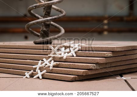 Tiling, Tile Trimming, Metering And Cutting. Repair Of The Floor. Sliced Gres Tiles.