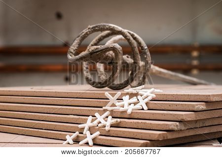 Tiling, Tile Trimming, Metering And Cutting. Repair Of The Floor. Sliced Gres Tiles.