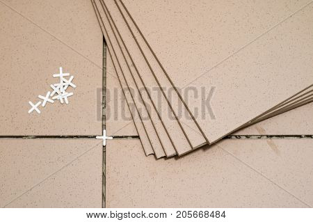 Tiling, Tile Trimming, Metering And Cutting. Repair Of The Floor. Sliced Gres Tiles.